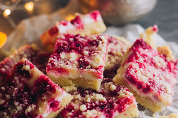 Delicious pie with raspberries and curd cheese. Pieces of pie on the table