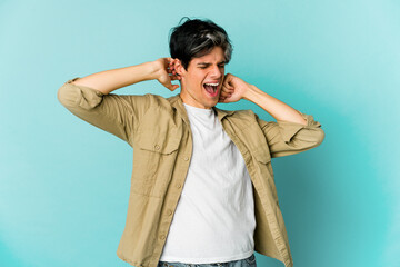 Young caucasian skinny man expressing emotions isolated on blue background