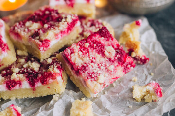 Delicious pie with raspberries and curd cheese. Pieces of pie on the table