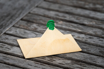 Open brown paper envelope lying on a table