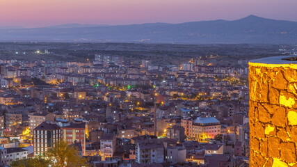 Obraz premium Aerial view from old castlethe in historical city town of Nevsehir day to night timelapse
