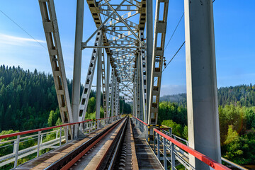Metal railway bridge over the river