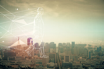 Double exposure of start up theme drawings over cityscape background. Concept of success.
