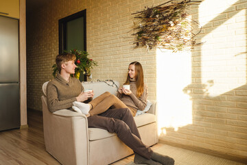 Obraz premium Beautiful couple drinking cup of coffee