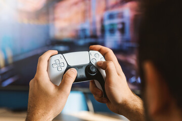 The guy is playing on the console. Modern gamepad.