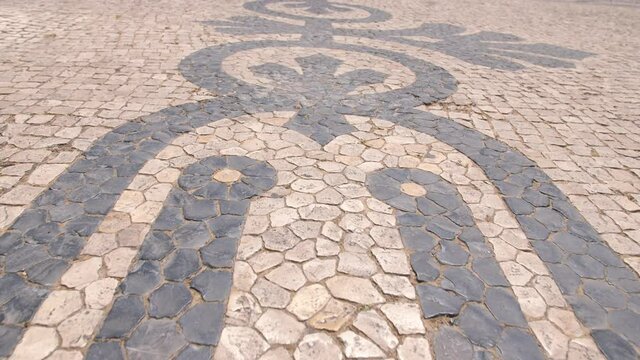 typical portuguese cobblestone pavement in Lisbon Portugal 4k