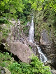 Fototapeta na wymiar Waterfall in mountains in China