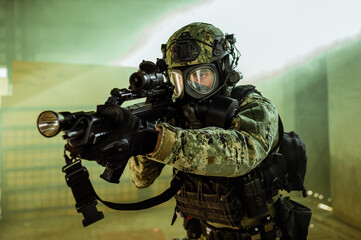 Croatian soldier in Cropat woodland uniform wearing gas mask M95 and assault rifle G36.