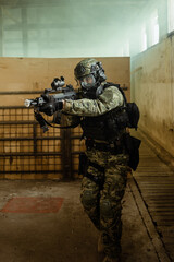 Croatian soldier in Cropat woodland uniform wearing gas mask M95 and assault rifle G36.