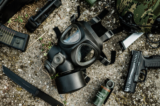 Military gas mask M95 surrounded with military gear. Flat lay photo on natural light.