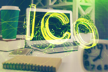 Multi exposure of blockchain and crypto economy theme hologram and table with computer background....