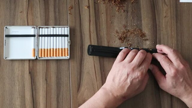 Smoke smoking break. Cigarette case. Preparing a cigarette.