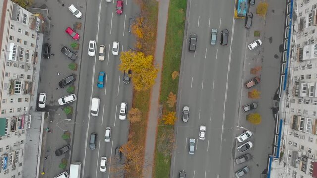 Cars traffic aerial drone top bird eye view rotation camera movement Kiev Ukraine