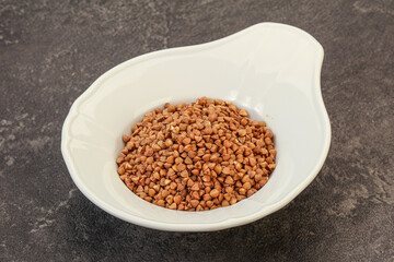 Raw buсkwheat cereal in the bowl