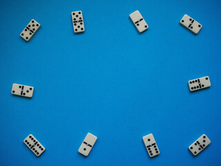 Domino background. Concept strategy. Cause and effect. Blue background with copy space