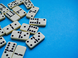 Domino background. Concept strategy. Cause and effect. Blue background with copy space