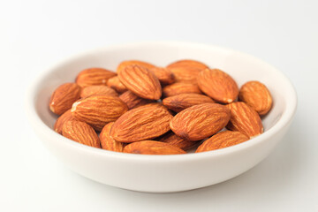 Savory almonds on white background