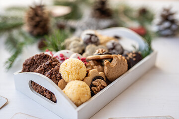 Close up of christmas cakes and cookies with santa hat 