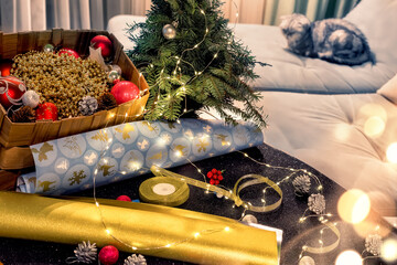 Various decorative items for wrapping gifts and decorating the Christmas tree. Cozy home...