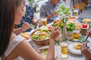 Group of Asian friends having dinner in a restaurant.