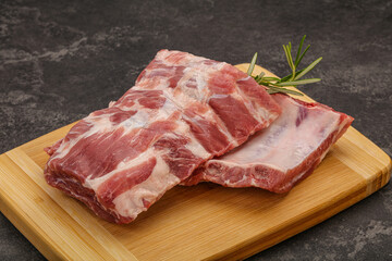 Raw pork ribs served rosemary