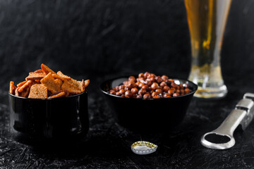 Beer snacks. Beer on a dark background.