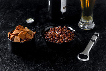 Beer snacks. Beer on a dark background.