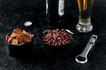 Beer snacks. Beer on a dark background.
