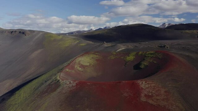 Red Volcanic Soil In Crater Of Raudaskal At Daytime In Southern Iceland.  -aerial arc