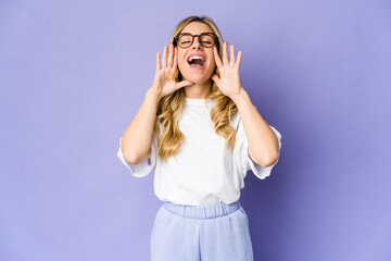 Young caucasian blonde woman shouting excited to front.