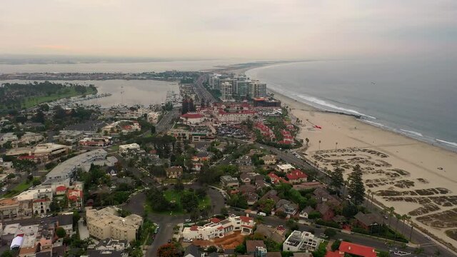 Silver Strand From Hotel del Coronado And Coronado Beach With Letters On Sand In San Diego County, California, USA. - aerial sideways