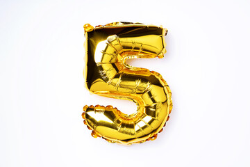 Creative layout. Golden foil balloon number and digit five 5. Birthday greeting card. Anniversary...