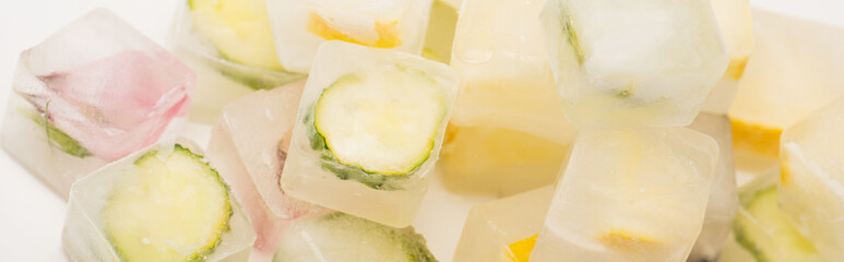 vegetable and fruit ice cubes for facial care on white surface, 