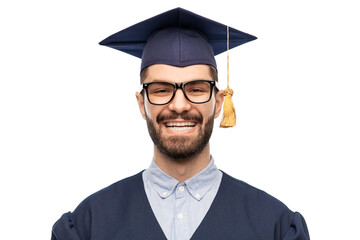 education, graduation and people concept - happy smiling male graduate student in mortar board and bachelor gown over white background