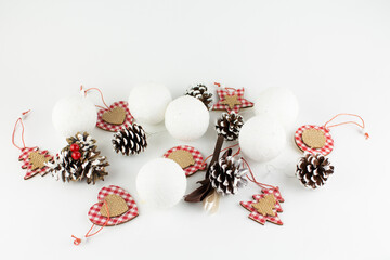 Christmas tree toys pine cones and balls on a white background