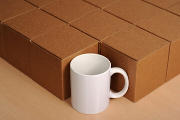 white sublimation mug among cardboard boxes