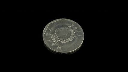 Malta 50 cents of Lira coin macro isolated shot, year 1991