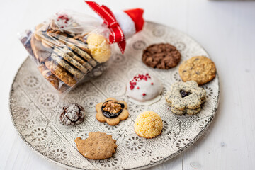 Close up of christmas cakes and cookies with santa hat 