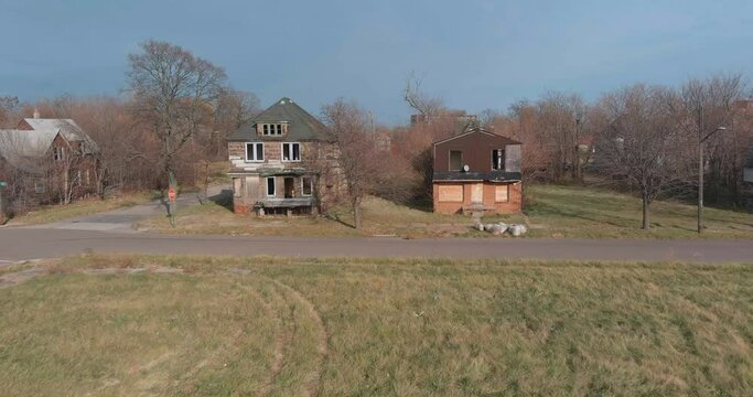 Drone view of dilapidated house in a Detroit neighborhood. This video was filmed in 4k for best image quality.