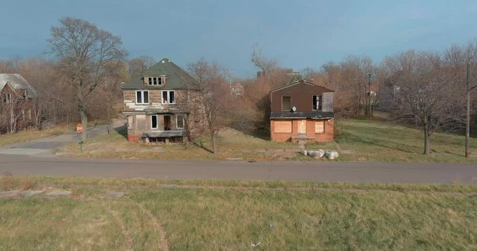 Drone view of dilapidated house in a Detroit neighborhood. This video was filmed in 4k for best image quality.