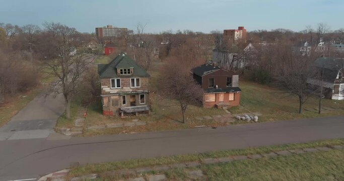 Aerial view of dilapidated house in a neighborhood in the city of Detroit, Michigan. This video was filmed in 4k for best image quality.
