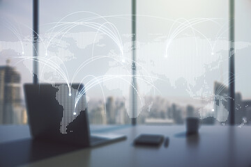 Double exposure of abstract digital world map with connections and modern desktop with laptop on...