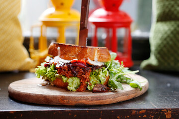 Sandwich with mutton and grilled vegetables.
Appetizing dish. Proposal to serve the dish. Culinary photography.