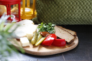 Fototapeta na wymiar Pate with pickled vegetables. A savory appetizer. Appetizing dish. Proposal to serve the dish. Culinary photography.