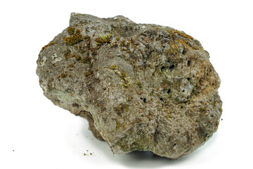 Old stones on a white background overgrown with moss