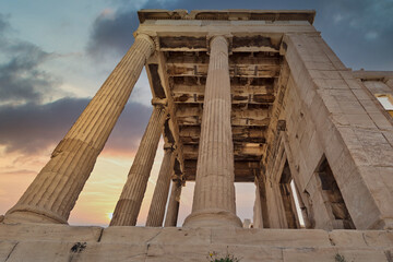 sundown in Athens Greece, ionic order ancient temple on Acropolis and dramatic sky background