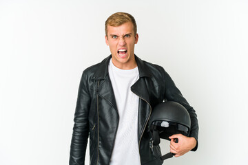 Young caucasian man holding a motorbike helmet isolated on white background