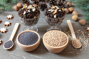 Kutia in glass bowls, poppy seeds and wheat grains in wooden bowls