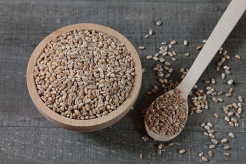 Wheat grains in a wooden bowl