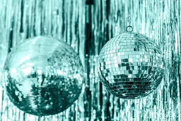 Festive aquamarine background. disco ball on Green tide background. Christmas. Wedding. Birthday. color of the year